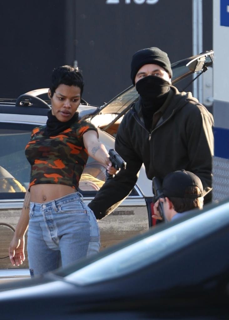 Leonardo DiCaprio slaps Teyana Taylor's booty while filming an armored truck robbery scene on the set of Paul Thomas Anderson's movie, known as 'BC Project,' in Sacramento, California.