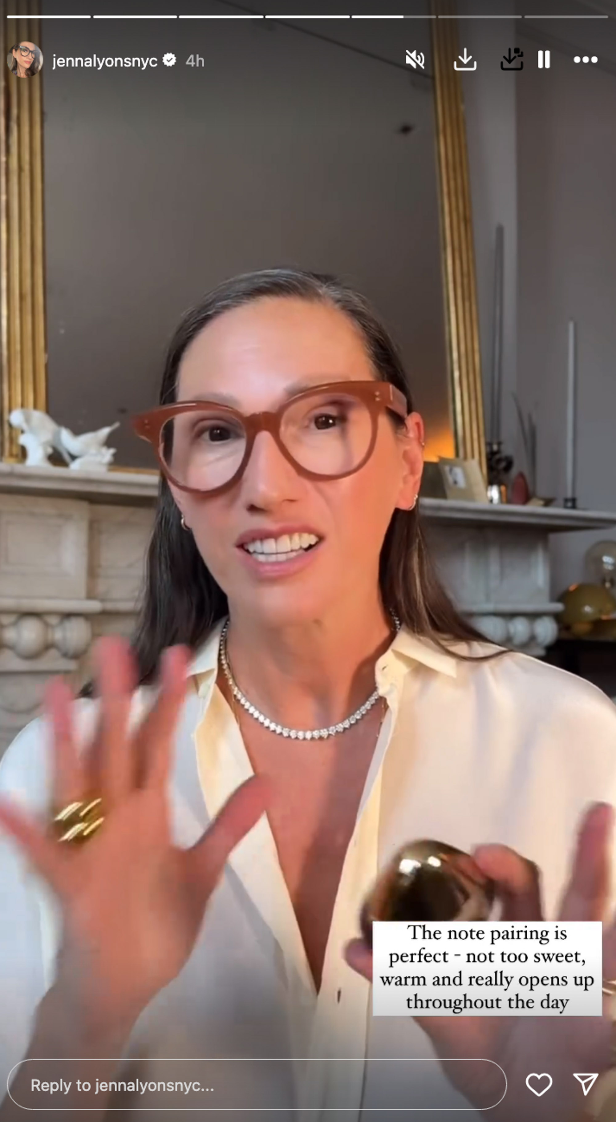 Jenna Lyons holding a perfume bottle